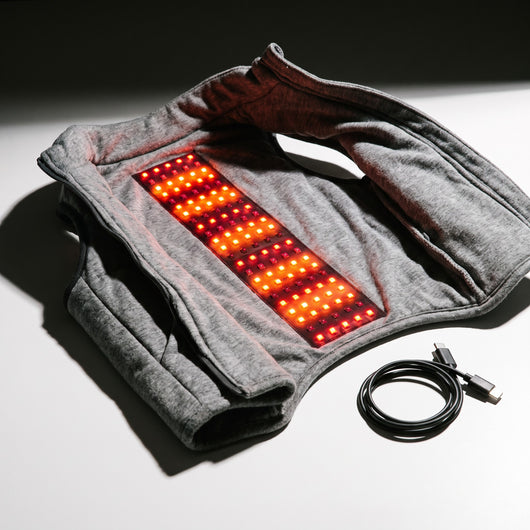 Inside of the vest showing the red and near-infrared LED panel and USB-C cable