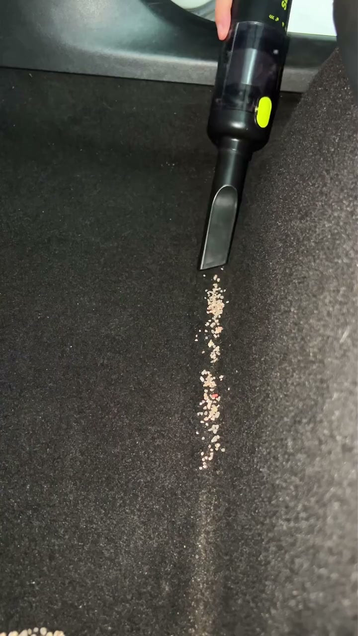 SEESE vacuum lifting dry crumbs from a car footwell