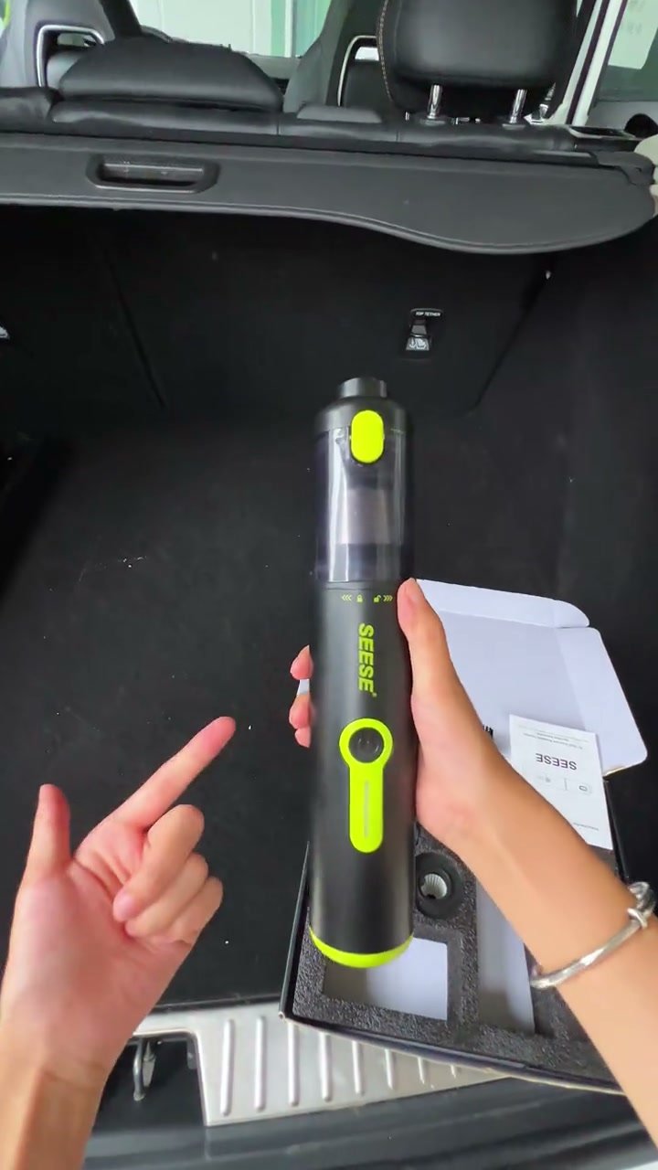 SEESE vacuum held upright with its controls visible